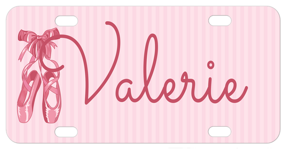 Pretty ballet slippers tied with a bow on the straps on a soft pink striped background personalized license plate with any name