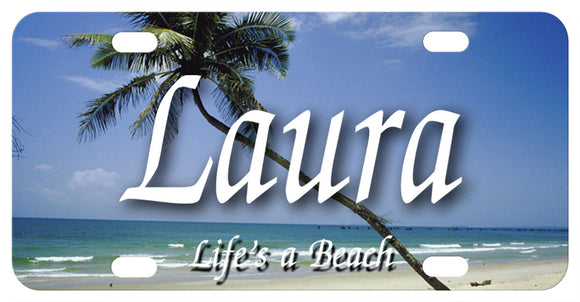 Beach with slanted palm tree going diagonally up the plate from right to left. Any name in the center. We've Added Life's A Beach to the bottom, but you can personalize with any custom text on bottom and top too