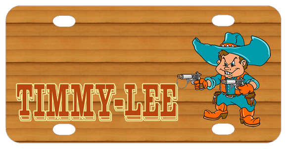 Name on left in shadowed text with cowboy with big rimmed cowboy hat holding pointed guns in both hands on right. Wood tone background and cowboy is dressed in blueish teal and rusty orange