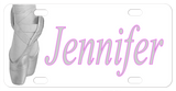 Greyscale depiction of ballet dancers feet in toe shoes on pointe, with any name personalized on a custom license plate for ballerinas. 