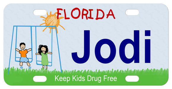 Florida license plate with kids on swing and sunshine
