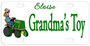 Cartoon woman with baseball cap riding on a tractor. Plate says Grandma's toy and a name but you can personalize however you want.