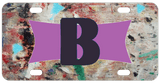 Grungy looking background with any name or initials on a purple ribbon frame personalized license plate 