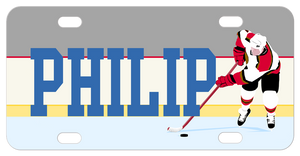 Hockey player pushing puck on ice to the right of any personalized name