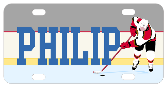 Hockey player pushing puck on ice to the right of any personalized name