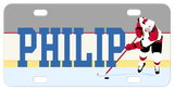 Hockey player pushing puck on ice to the right of any personalized name