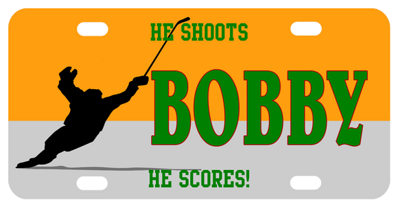 Hockey player skating with raised stick after shooting goal. personalized text on top, center, and bottom of license plate
