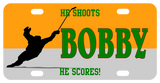 Hockey player skating with raised stick after shooting goal. personalized text on top, center, and bottom of license plate