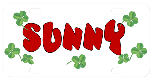 4 leaf clovers scattered randomly around the license plate with any name in the center.  Name shown in red, this font is not in the choices but you can chose As Sample in the drop down if you want it as shown with your name.
