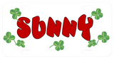 4 leaf clovers scattered randomly around the license plate with any name in the center.  Name shown in red, this font is not in the choices but you can chose As Sample in the drop down if you want it as shown with your name.