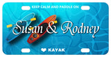 2 kayaks in water illustration on a custom license plate personalized with 2 names in the center and text on top and bottom