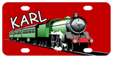 red background with locomotive train in shades of green chugging on tracks with name diagonal above the train cars