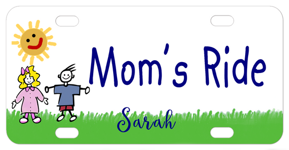 Cute cartoon drawing of 2 kids standing on the grass with a sunshine that has a smiley face. Plate Says Mom's Ride in center in a kids font and the name Sarah on bottom. You can personalized with any text instead.