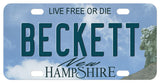 New Hampshire, mini license tag with face in mountain on the right edge of the plate