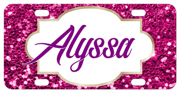 imprint of large pink tone glitter flakes (not real glitter) and any name in a vintage frame design on a bike plate