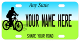 Bike Rider on bike plate with blue on top for sky and green on bottom for grass. Your state name on top and share the road on bottom