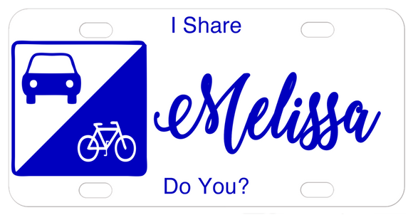 Sign on left with car and bike in triangle sections license plate design with your custom text to let everyone know you share the road