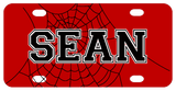 Red background with black spiderweb and any name personalized over part of  the web centered in plate