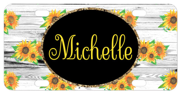 Sunflowers randomly placed on a whitewash wood background. Bordered oval in center with any name or initials